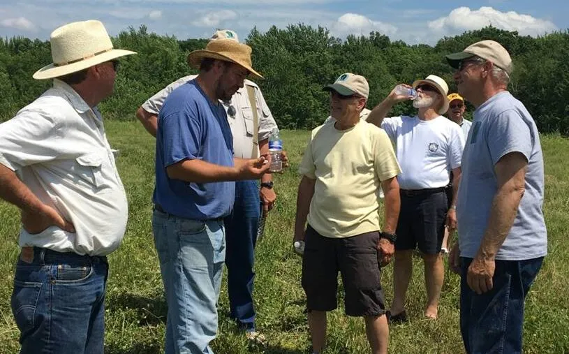 people talking in field