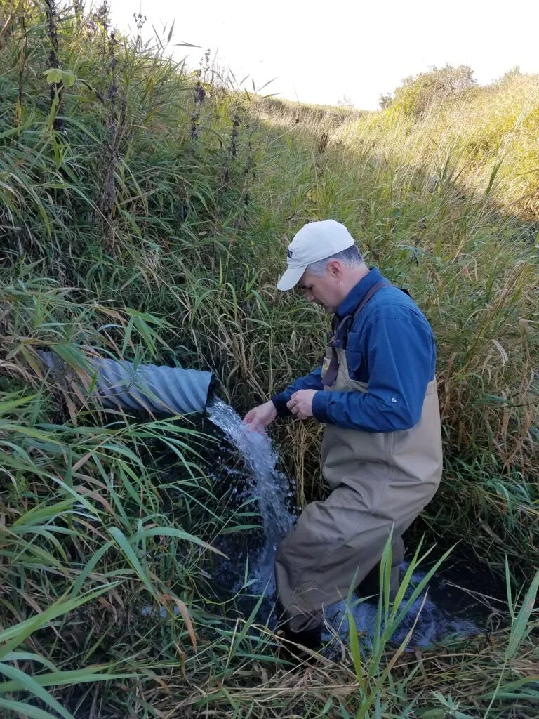 Minnesota DNR staff collects water samples