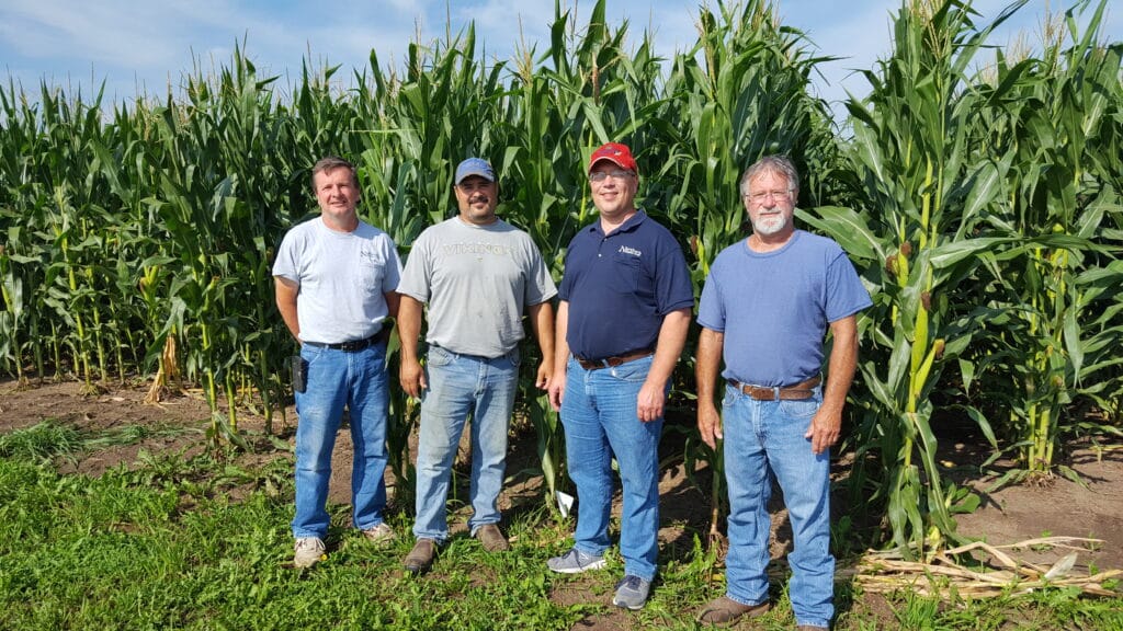 Jeff Irvin (Northern Country Coop), Tom Cotter (farmer cooperator), Nathan Augustine (Northern Country Coop), and Al Slowinski (farmer cooperator) are examining the relationship between nitrogen application, water quality and a farmer's return on investment. 