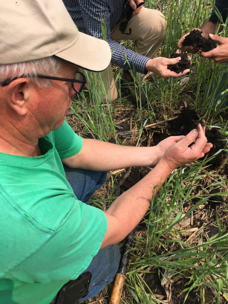 John Becker, Rice Creek Watershed farmer, explains how cover crops affect his soil.