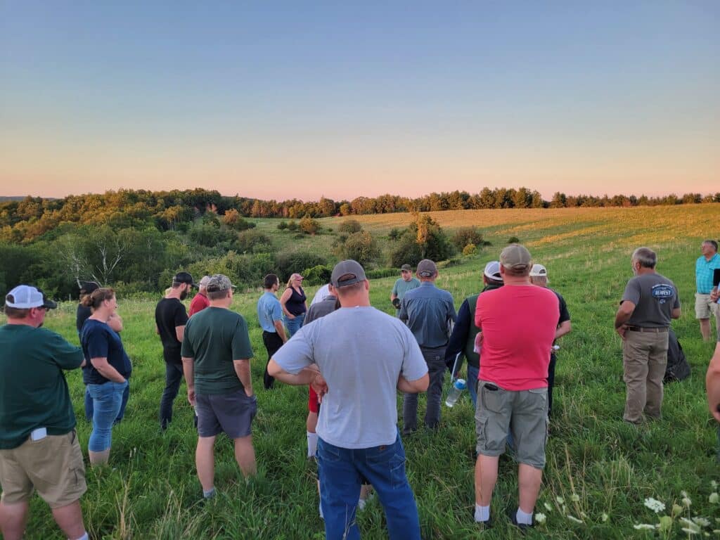 Coon Creek Community Watershed Council learns about managed grazing and perennial crop practices and profitability.
